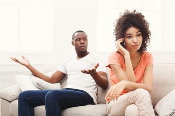 Young black couple quarreling at home