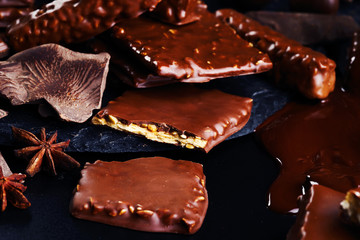 Close-up. A variety of chocolate products on a dark background.