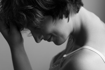 Fototapeta premium A beautiful and sensual girl with curly hair woke up