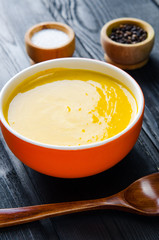 Carrot soup served on the table in bowl