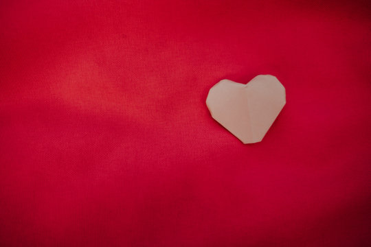 pink heart placed on red background. image for valentine day, idea, love, celebration, copy space, decoration concept