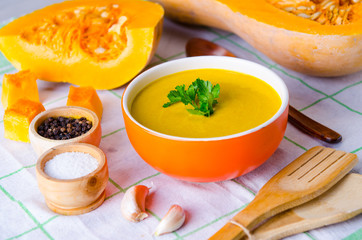 Pumpkin soup served on the table in bowl