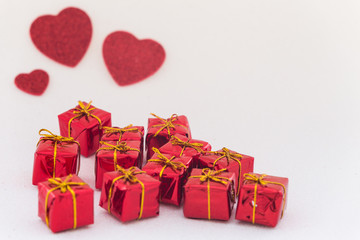 decorative hearts and gift boxes with space for dedications for a loved one.