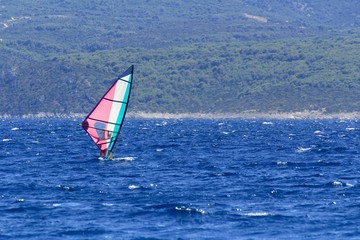Man on winsurfing on the Adriatic Sea in Croatia