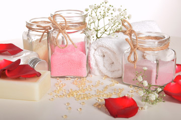 Fototapeta na wymiar rose bath salt gray soap and red rose petals with pearls of vitamins