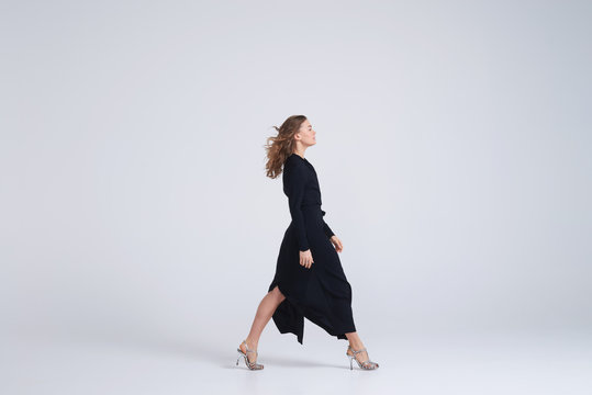 Woman Model Walking In Trend Black Dress