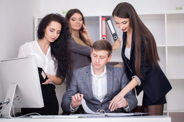 Fototapeta premium Young creative managers team working with new startup project in modern office.