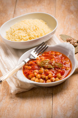 couscous and chickpeas with tomato sauce, selective focus