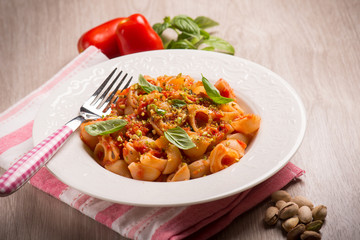 pasta with fresh tomatoes pistachio and basil,selective focus