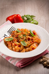 pasta with fresh tomatoes pistachio and basil,selective focus