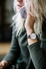 white women's wrist watch on the girl's hand