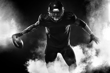 American football sportsman player on stadium. Sports banner and wallpaper with copyspace.
