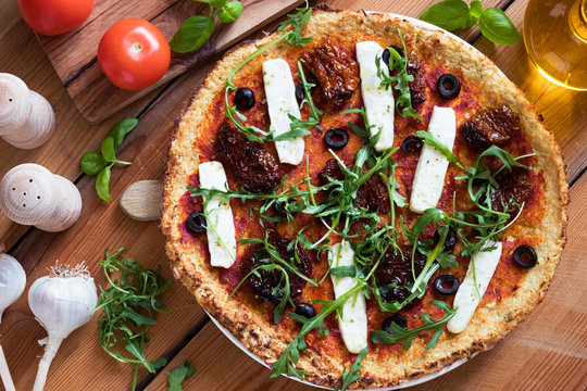 Gluten-free grain-free pizza made from cauliflower and almond flour, top view