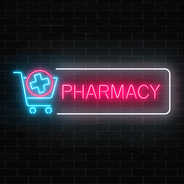 Neon pharmacy glowing signboard with medical cross in shopping cart on brick wall background.