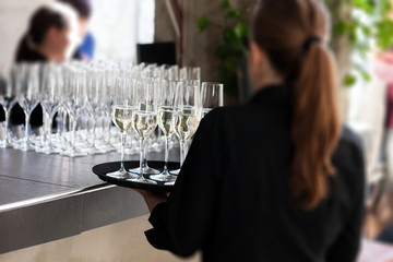 waitress serving wine in restaurant