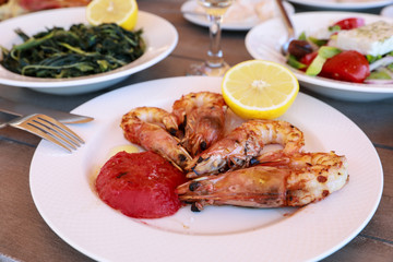 Shrimps cooked on grill in the greek tavern.