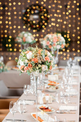 focus on glasses. Banquet table in the restaurant, the preparation before the banquet. the work of professional florists.