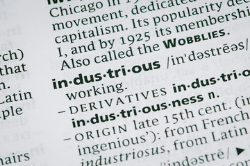 Fototapeta premium Macro shot of word in the dictionay- Industrious
