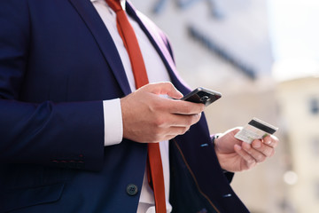 Businessman is paying with a credit card.