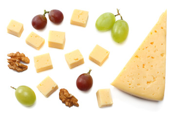 piece of cheese with grapes isolated on white background