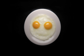 Smiley face made with fried eggs