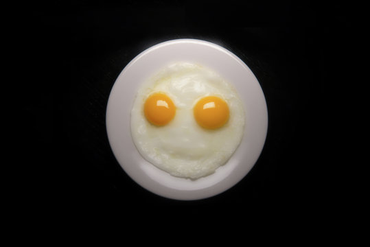 Smiley face made with fried eggs