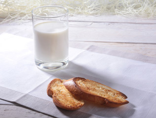 Morning Breakfast set with orange jam on bread toast and milk in glass.