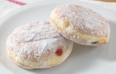 Plate of Fresh Donut Filled with Strawberry Jam
