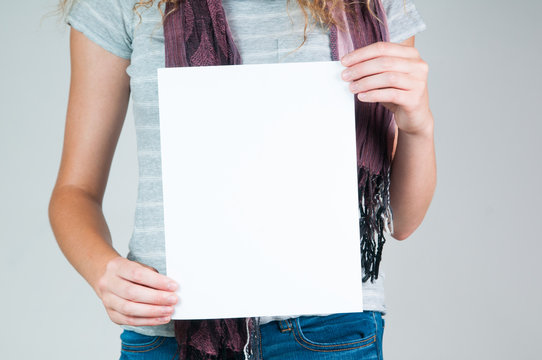 Woman Holding A Piece Of Blank Paper