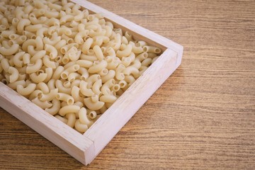 Elbow Macaroni or Gomiti Pasta in Wooden Tray