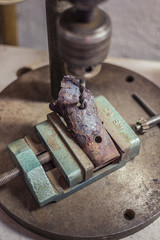 Borehole drilling into the iron pipe.