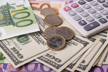 Fototapeta premium Dollar, euro banknotes, coins, calculator