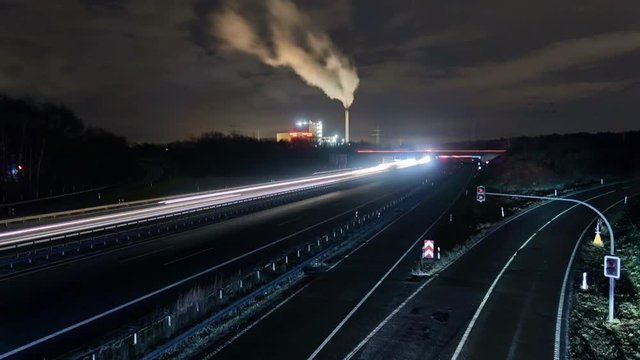 Traffic on freeway A2 near Hannover in Germany at winter night. Timelapse. 4K.