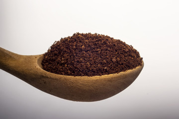 Full spoon of natural ground coffee