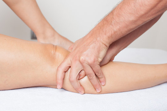 Massage therapist giving a knee massage