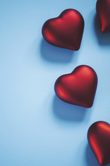 Fototapeta premium Happy Valentine's Day. Red hearts on blue background.