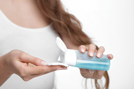 Women's Hands Hold Cotton Pad And Tonic