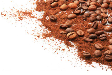 Whole coffee beans and ground on a white background