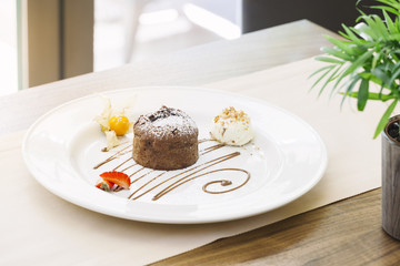 Molten chocolate cake dessert on white plate 