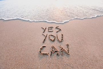 yes you can, motivational inspirational message concept written on the sand of beach - Powered by Adobe
