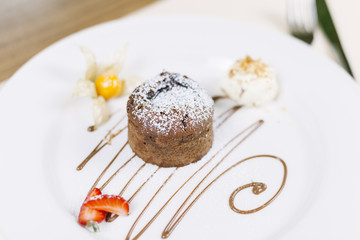 Molten chocolate cake dessert on white plate 