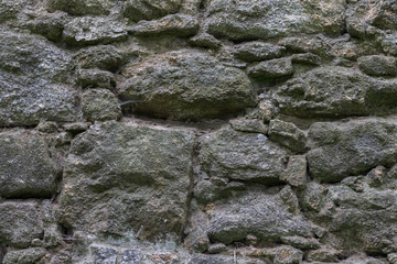 Stone wall of an abandoned castle