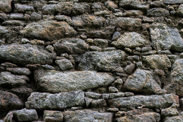Stone wall of an abandoned castle