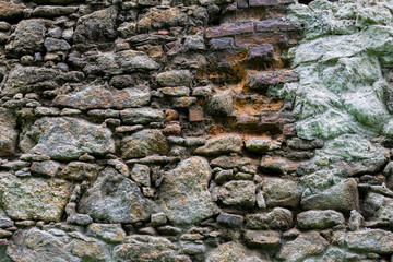 Stone wall of an abandoned castle