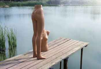 Mannequin in the role of people in the nature near the reservoir