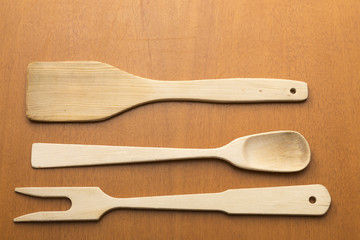 wooden kitchen utensils placed on table