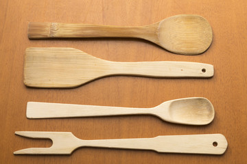 wooden kitchen utensils placed on table