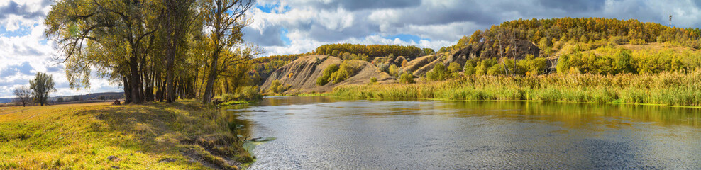 Autumn  landscape banner, panorama - river valley of the Siverskyi (Seversky) Donets, the winding river over the meadows between hills and forests, the northeast of Ukraine