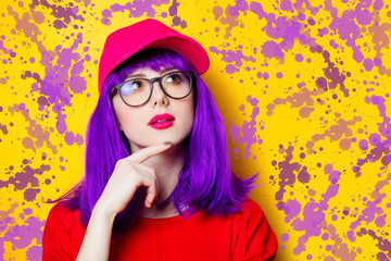 Woman with purple hair and eyeglasses