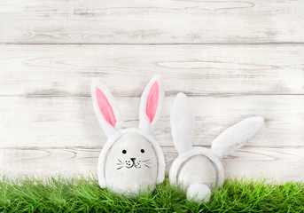 Funny bunnies green grass Easter eggs decoration